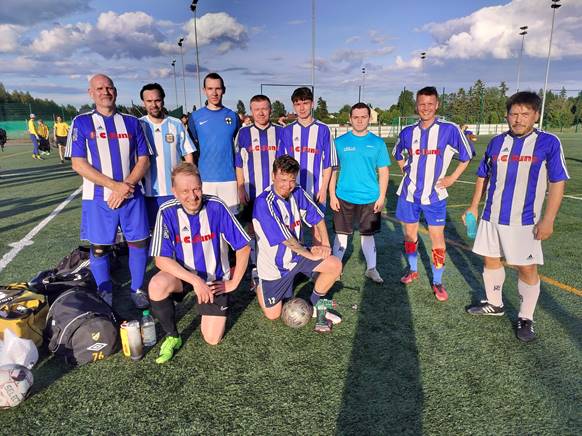 A group of men in football uniforms

Description automatically generated