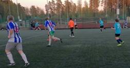 A group of people playing football

Description automatically generated